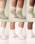 Collage of Piggy's vetiver (sage) and white socks shown on different skin tones.