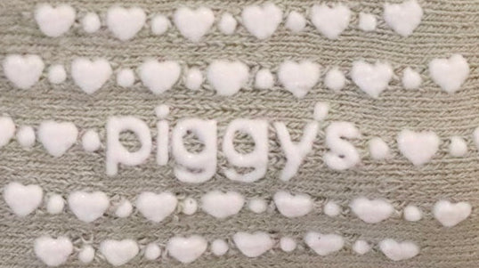 Silicone grippers of &#39;piggy&#39;s&#39; surrounded by hearts and dots on Piggy&#39;s baby crew socks in the color vetiver