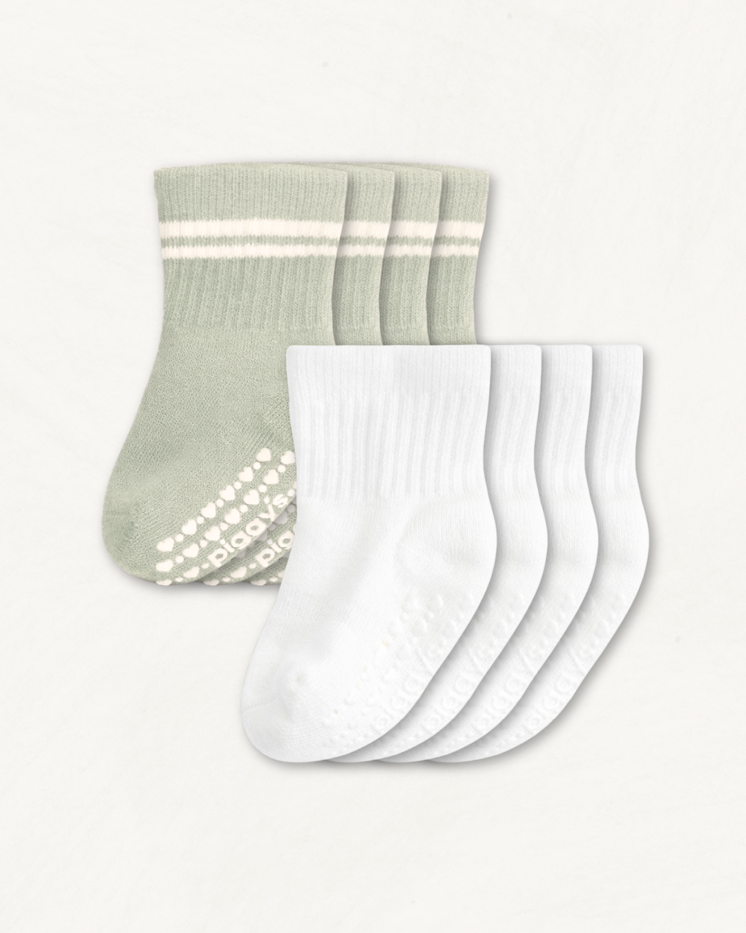 4-pack set of white and sage baby crew socks with silicone grips on an off-white background