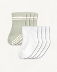 4-pack set of white and sage baby crew socks with silicone grips on an off-white background