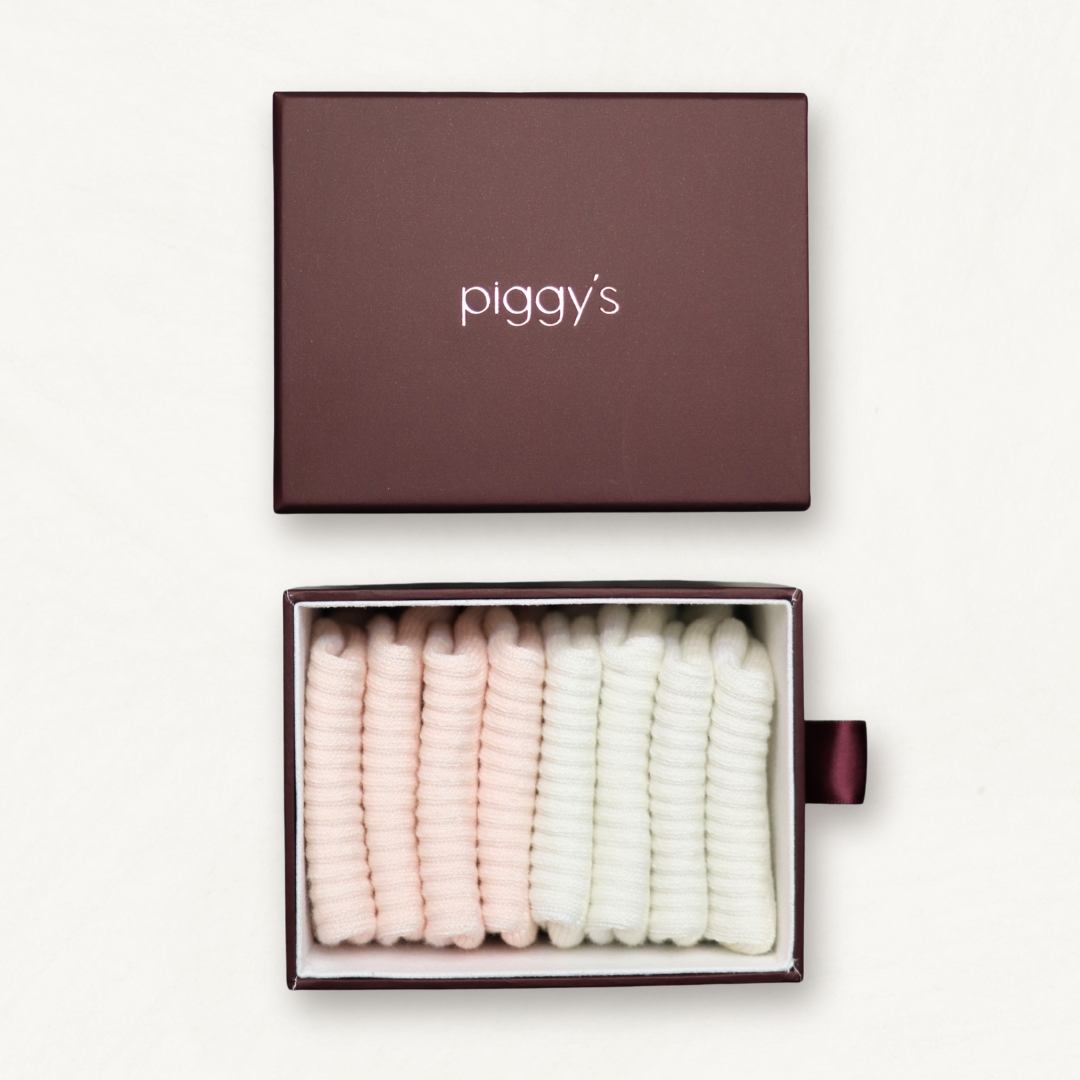 Piggy's custom sock box displaying bone and blush suede baby crew socks.