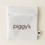 White mesh laundry pouch with zipper closure and 'piggy's' branding on a beige background